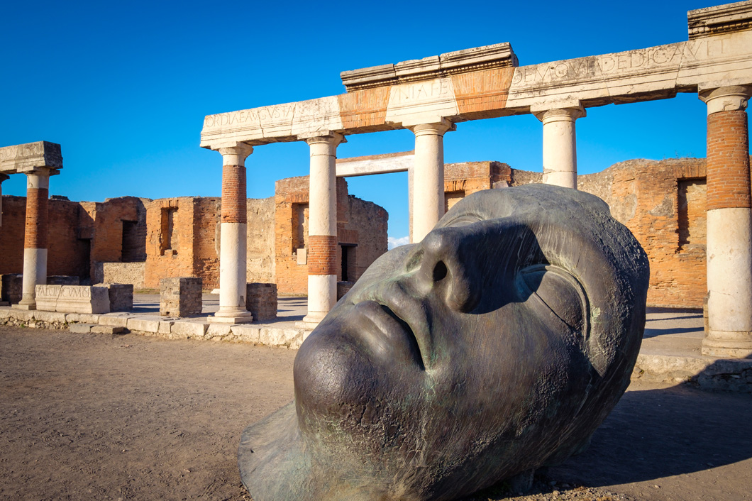 scenic-view-of-ruins-and-bronze-statue-in-ancient-2021-08-26-13-40-21-utc