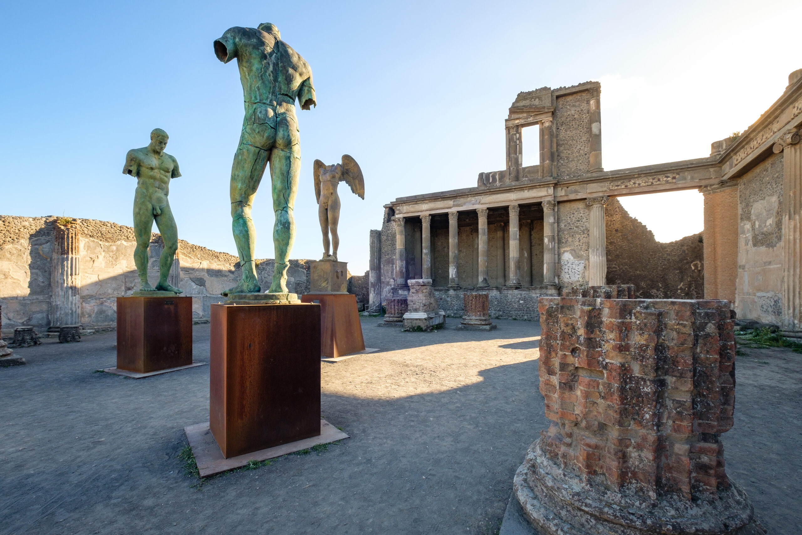 Scenic view of ruins and statues in ancient city of Pompeii, Italy